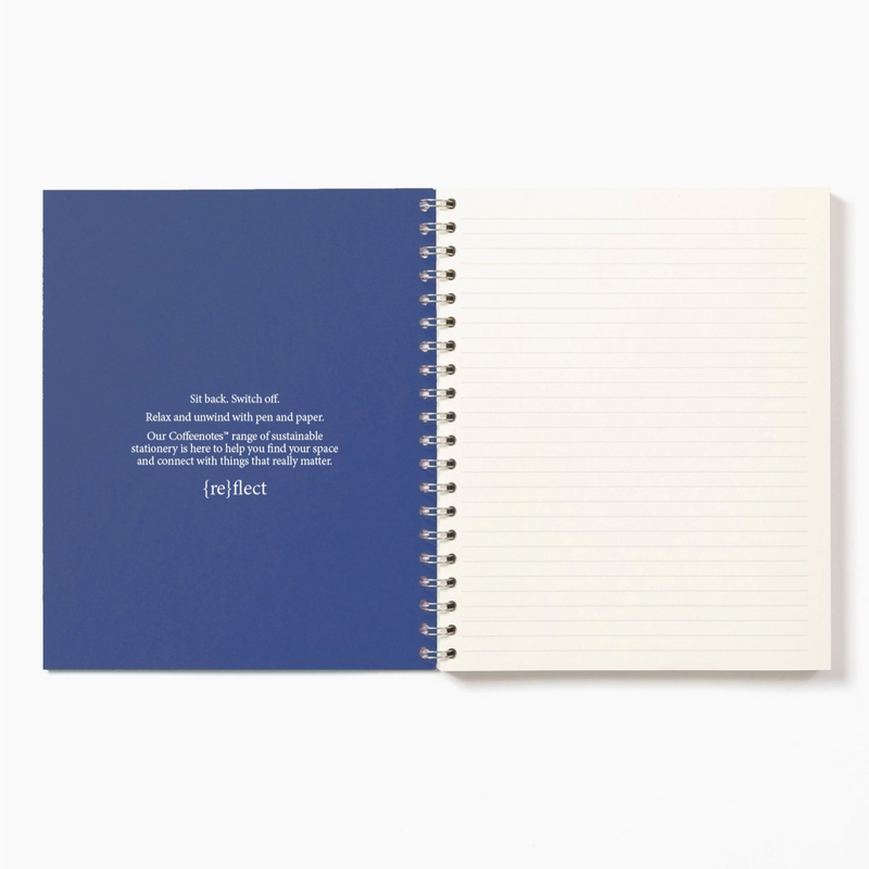 Spiral-bound notebook with blue cover and white pages on a white background