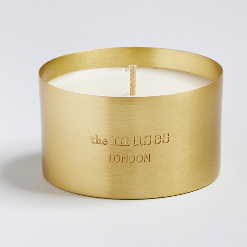 the muses london Be candle in a brass vessel with white background
