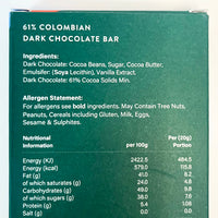 Dark chocolate bar packaging with ingredient list, allergen statement, and nutritional information on a green background.