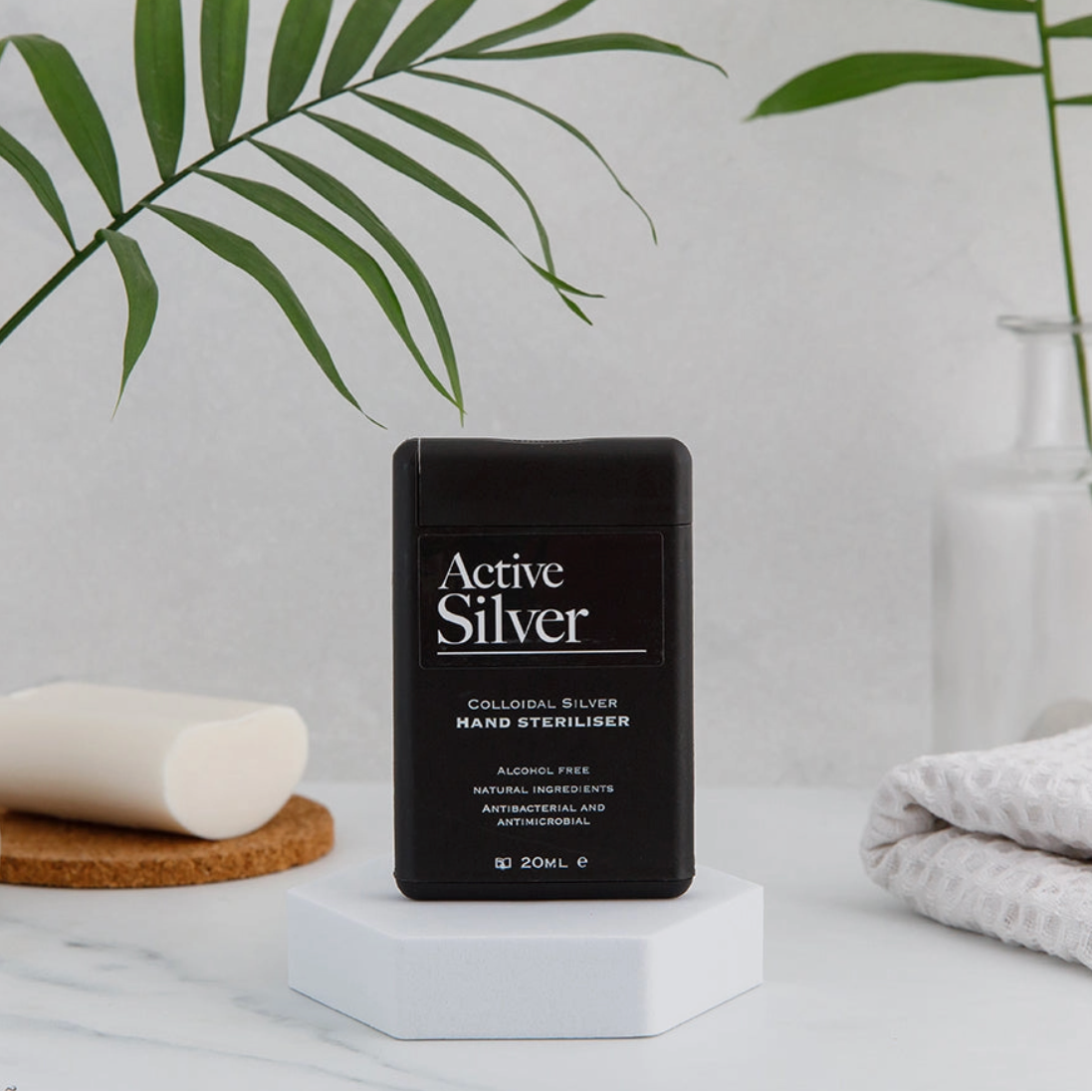 Image showing hand sanitiser on white background with green palm