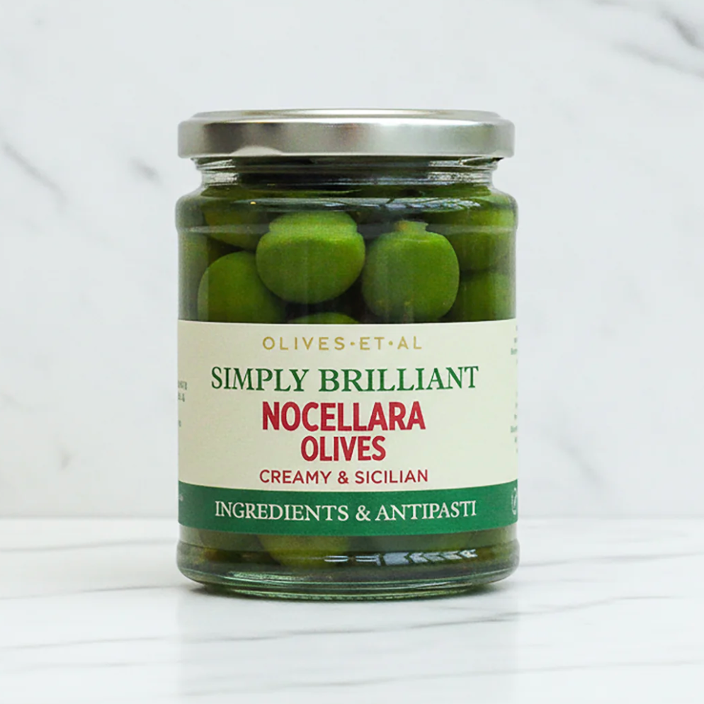 Jar of olives on marble background