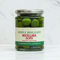 Jar of olives on marble background