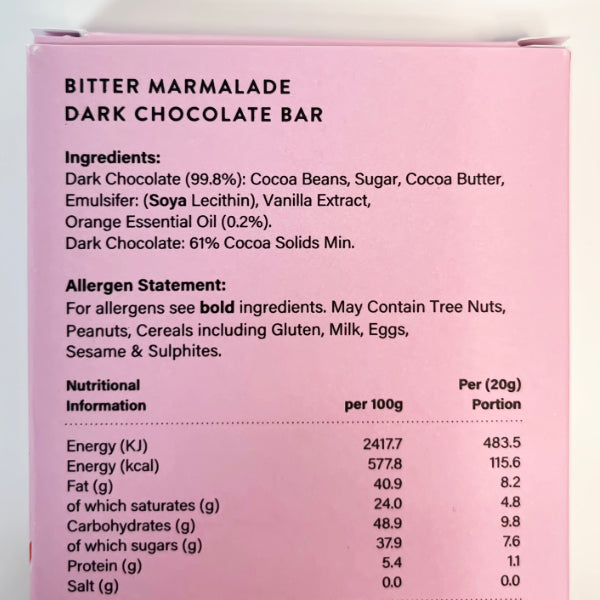 Pink packaging of a bitter marmalade dark chocolate bar with ingredient list, allergen statement, and nutritional information.