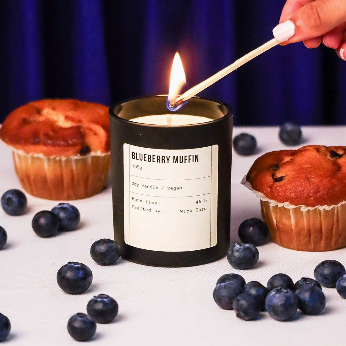 Blueberry Muffin Candle being lit with box from Wick Guru 165g