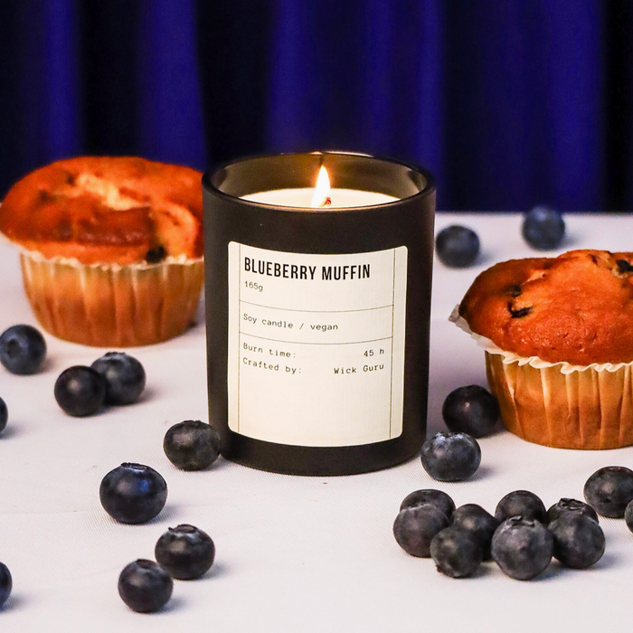 Blueberry Muffin Candle from Wick Guru 165g with muffins and blueberry's in the background