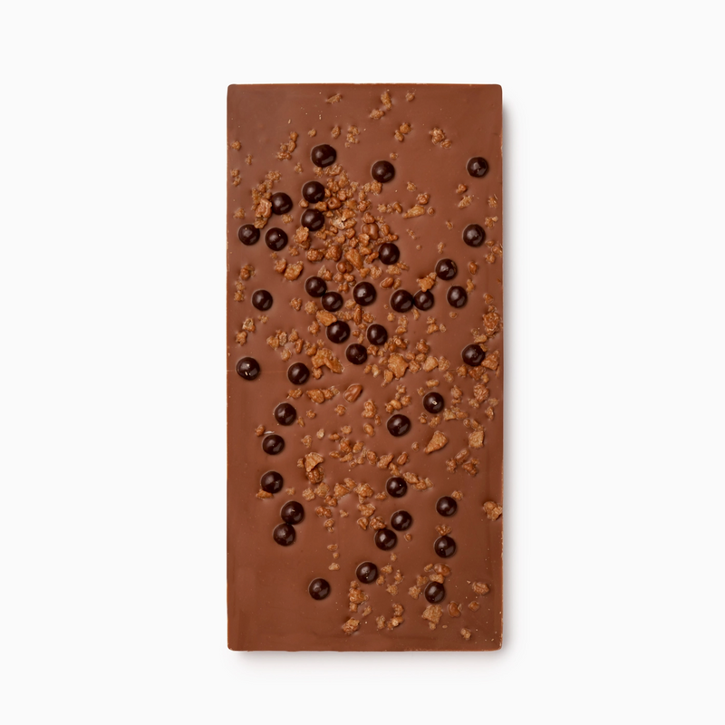 Chocolate bar with chocolate chips and popping candy on a white background