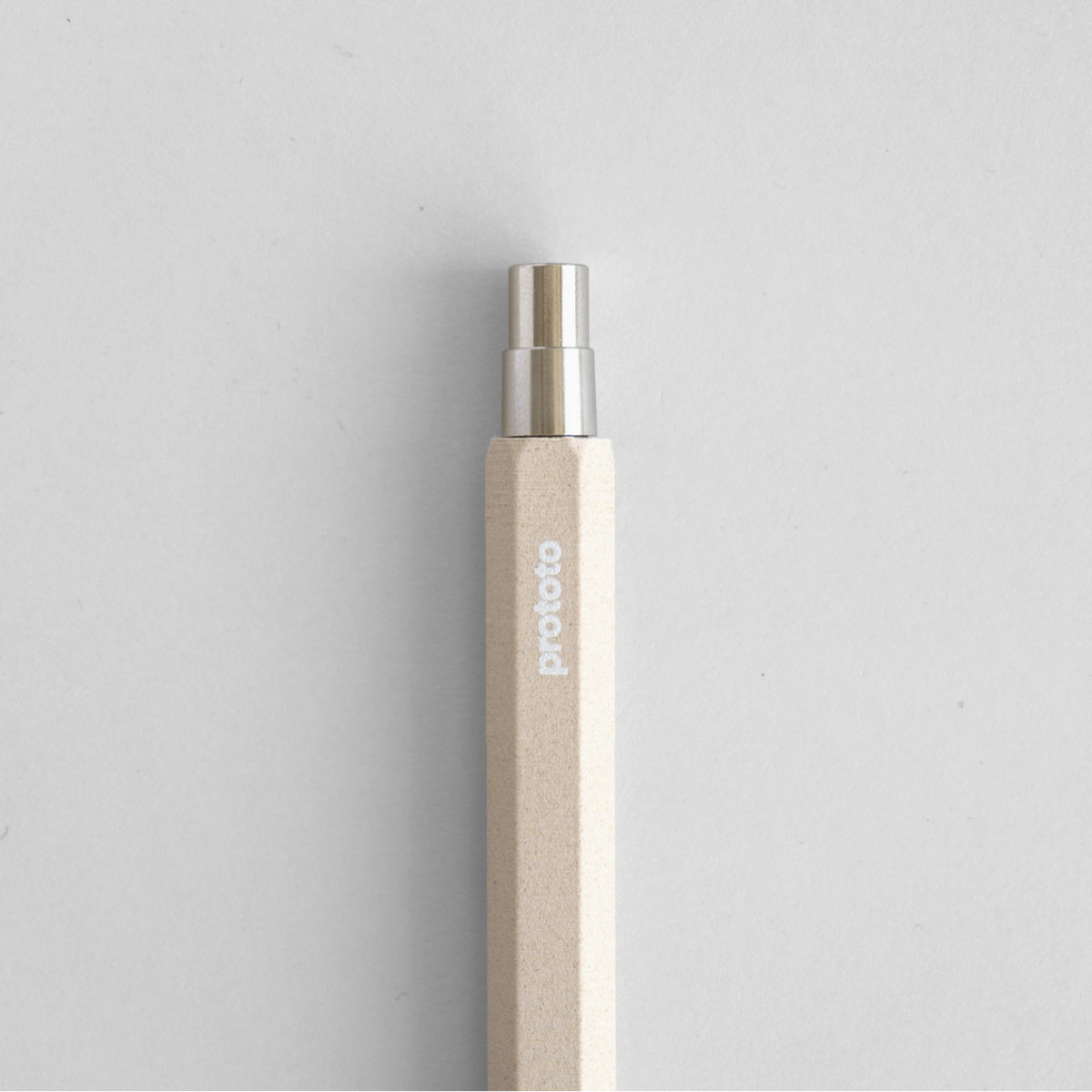 Circular Ballpoint Pen Natural colour metal button on white background