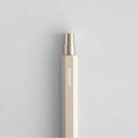 Circular Ballpoint Pen Natural colour metal button on white background
