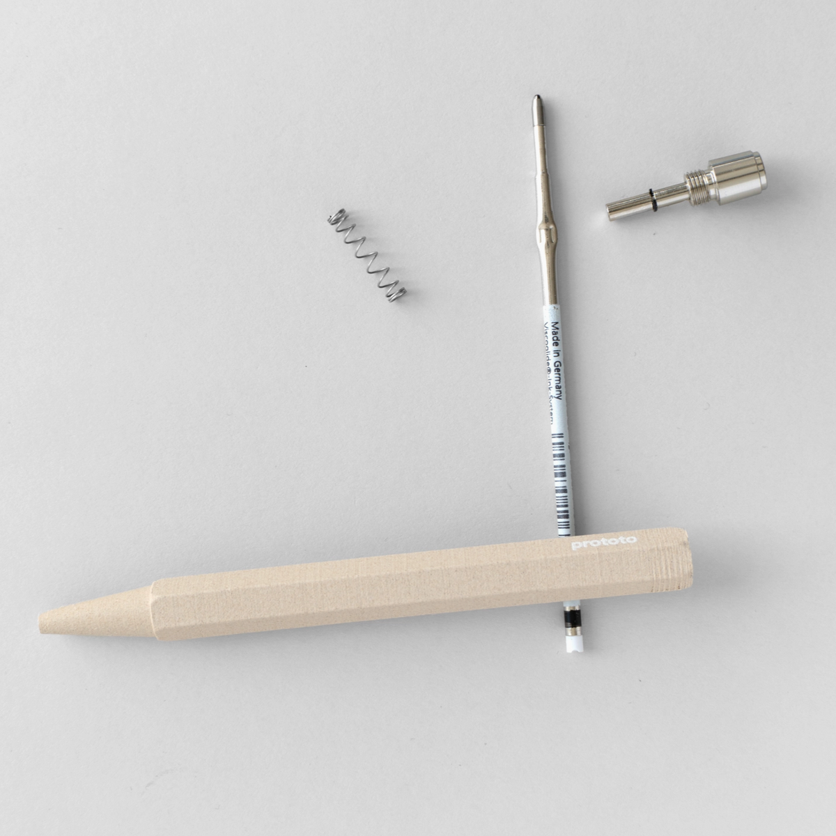 Circular Ballpoint Pen Natural colour taken apart on white background