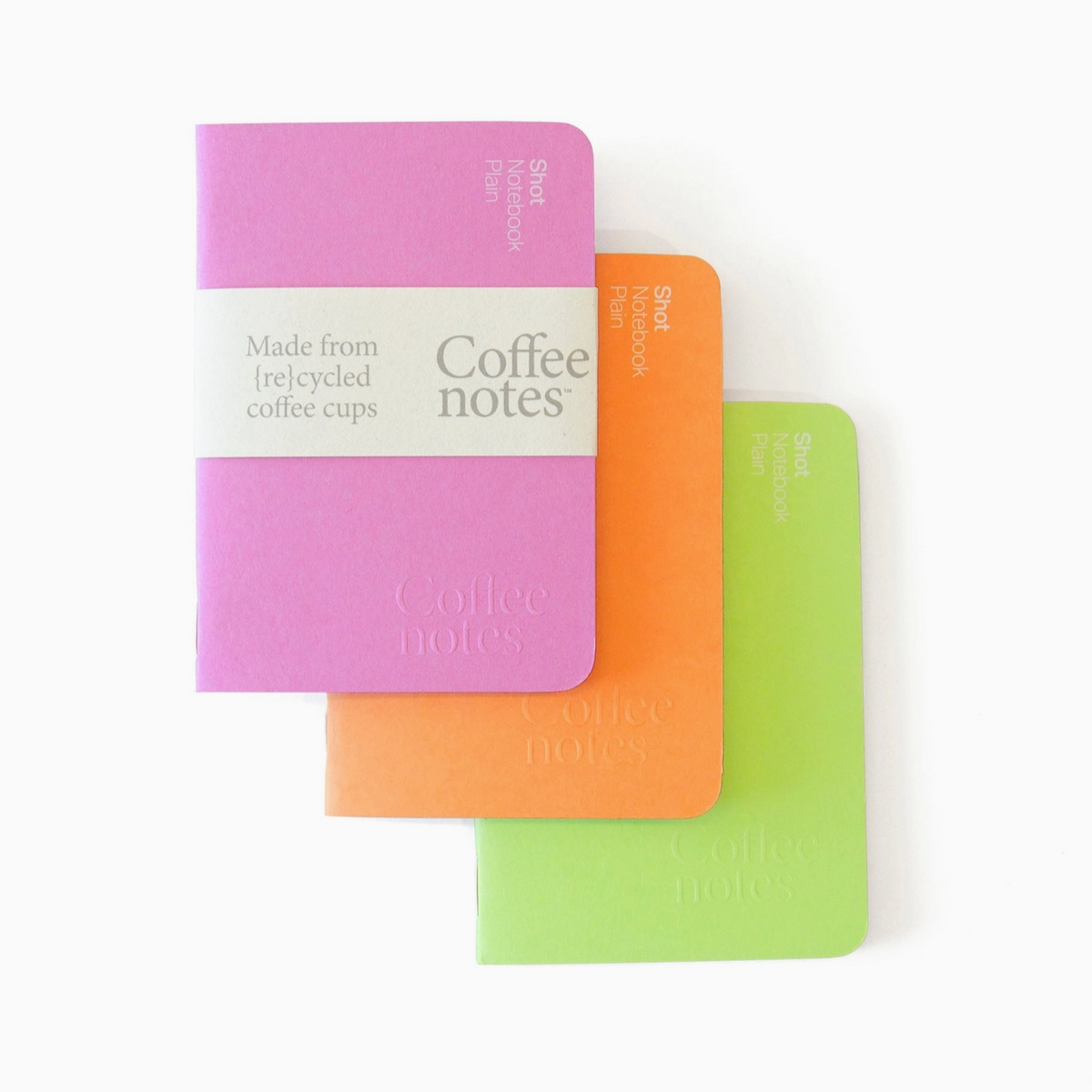 Three colorful notebooks labeled 'Coffee Notes' on a white background