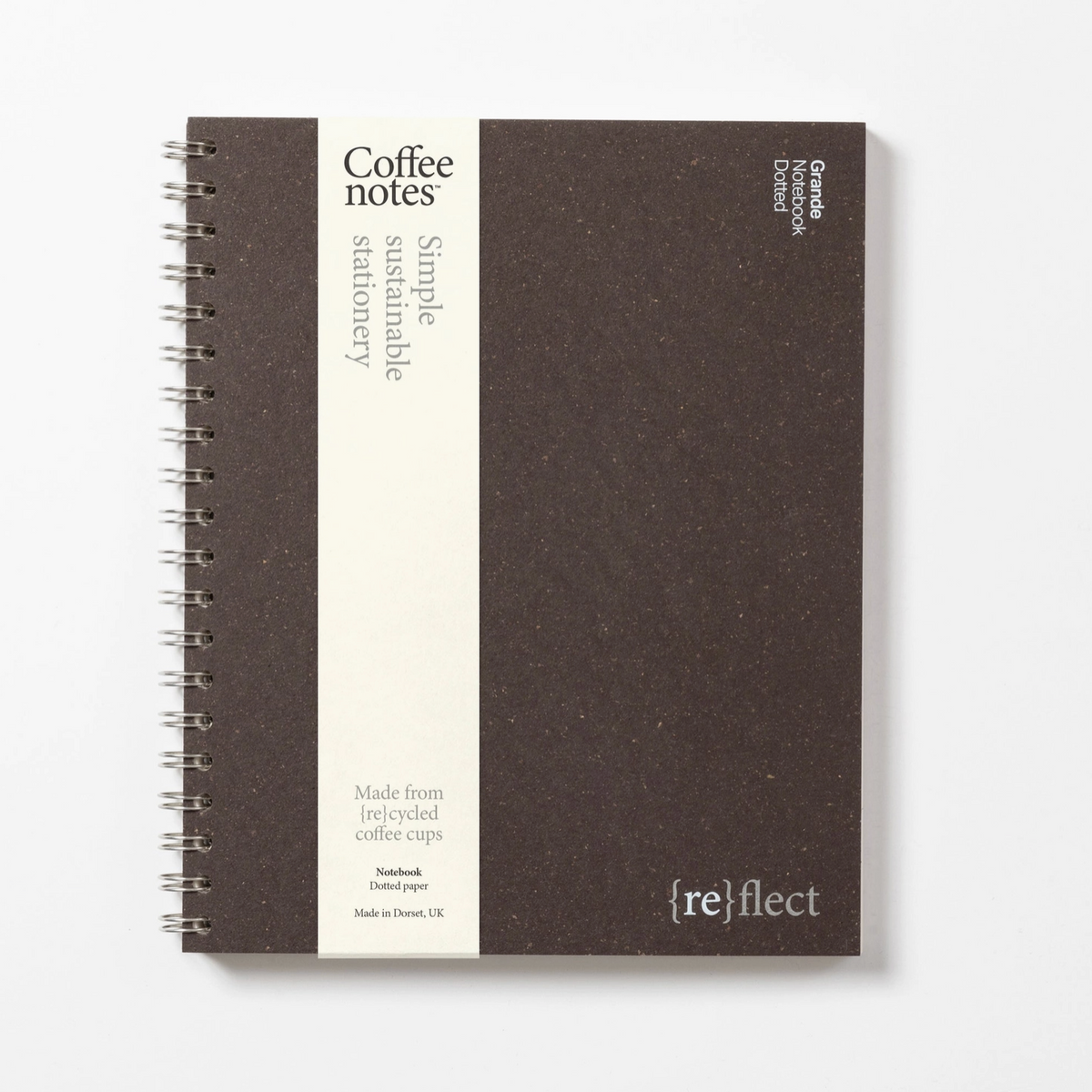 Dark brown notebook with 'reflect' branding on a white background