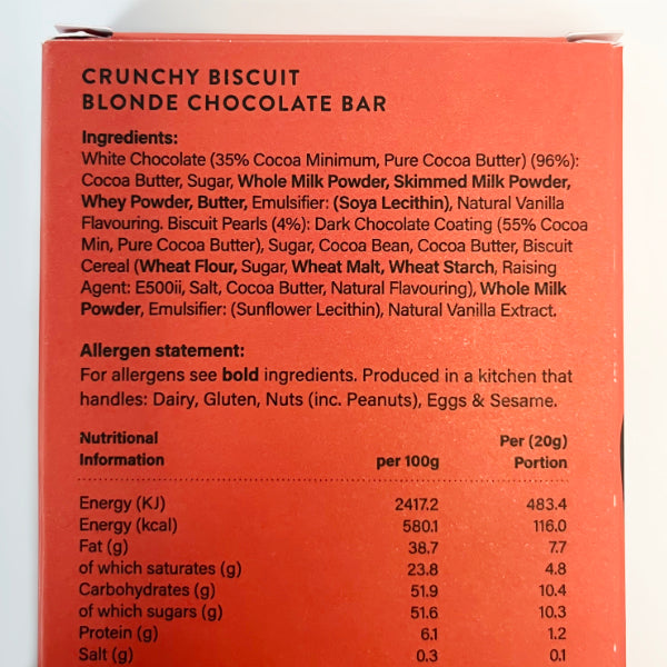 Back of a chocolate bar packaging with ingredients and nutritional information.
