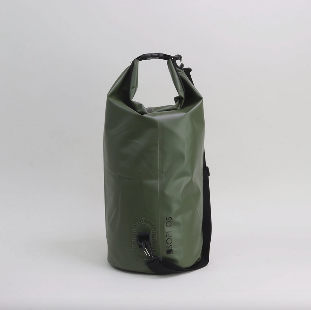 Green dry bag on grey background