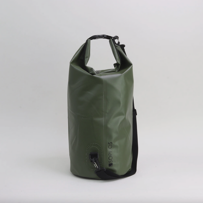 Green dry bag on grey background