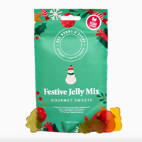 A green stand-up pouch of Festive Jelly Mix gourmet sweets with holiday illustrations and several gummy bears in front on a white background.