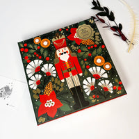 Decorative box with a nutcracker design on a white surface