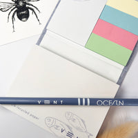 Up close vent for change sticky notes and ocean pencil
