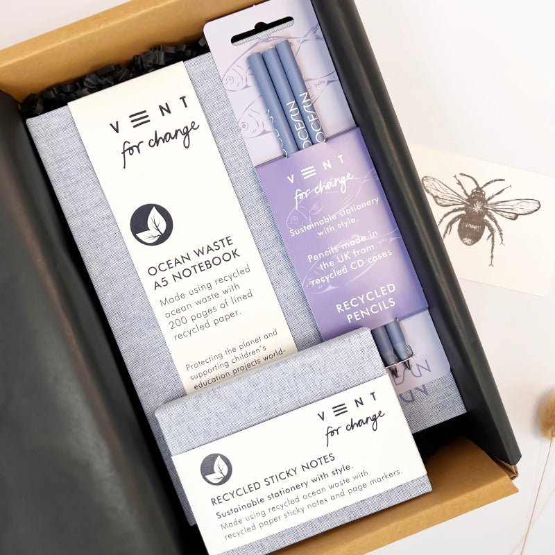 Packaged sustainable stationery set with pens, notebook, and sticky notes from Vent for Change.