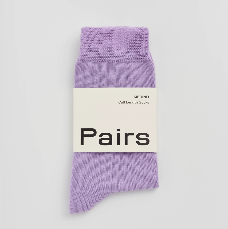 Lilac socks with Pairs label on light background