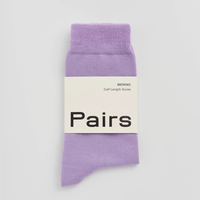 Lilac socks with Pairs label on light background