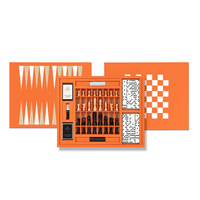 Backgammon set with pieces and board on an orange background