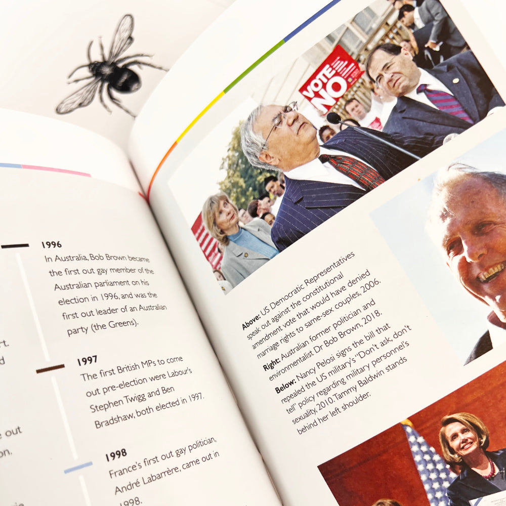 Open book with political images and text, featuring a spider illustration on a white background.