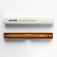 Mustard yellow pen in box on white backround