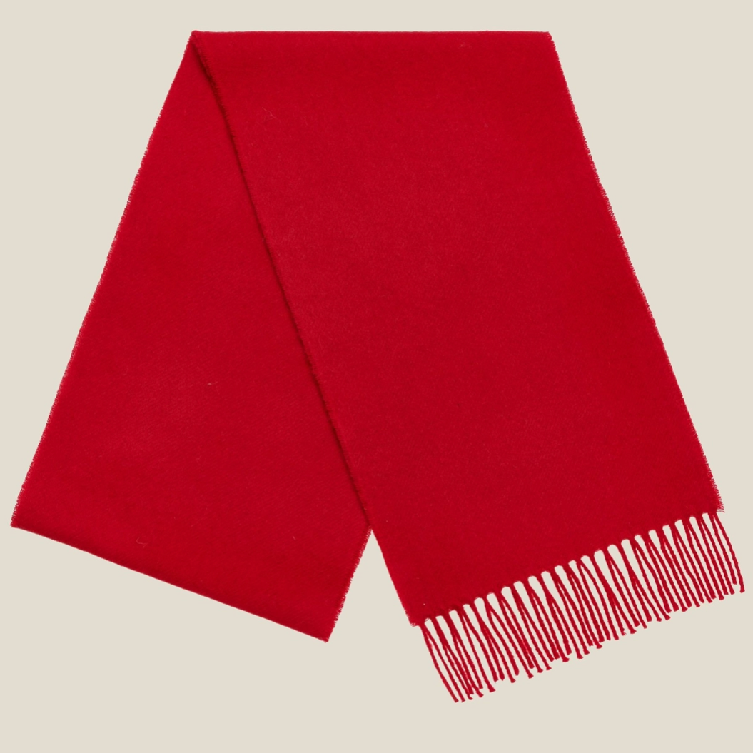 Red scarf folded on white background 