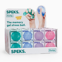 A retail display box of SPEKS Gump. gel stress balls, showing multiple color options including teal, blue, purple, and pink in a white cardboard counter display.
