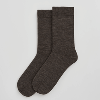 Pair of brown socks on a light grey background