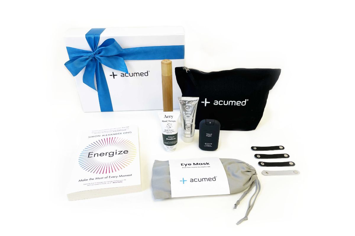 New year corporate gifts including Energize book, branded eye mask and travel accessories