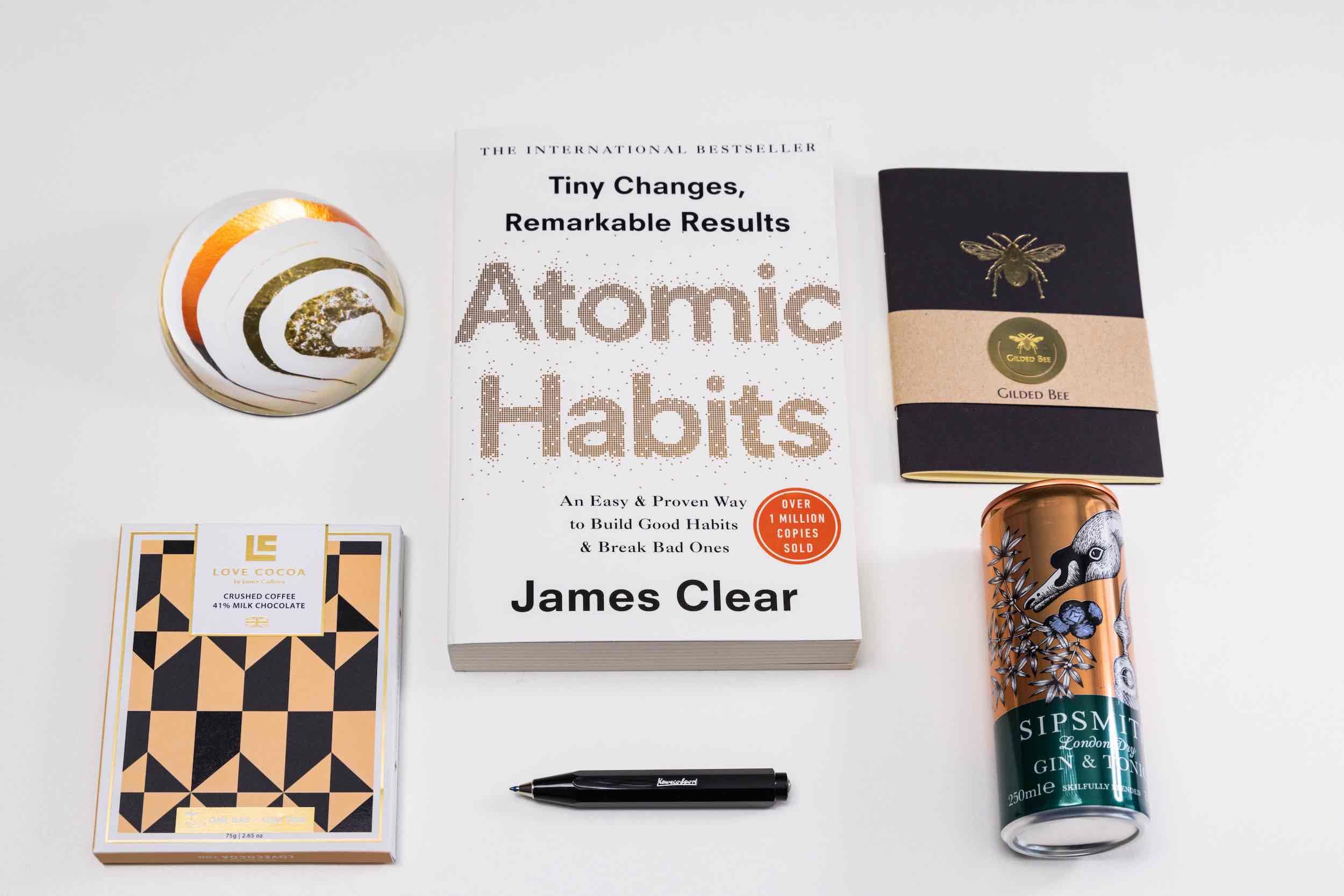 Christmas Employee Gifts with Atomic Habits book by James Clear, Sipsmith G&T and a Gilded Bee notebook